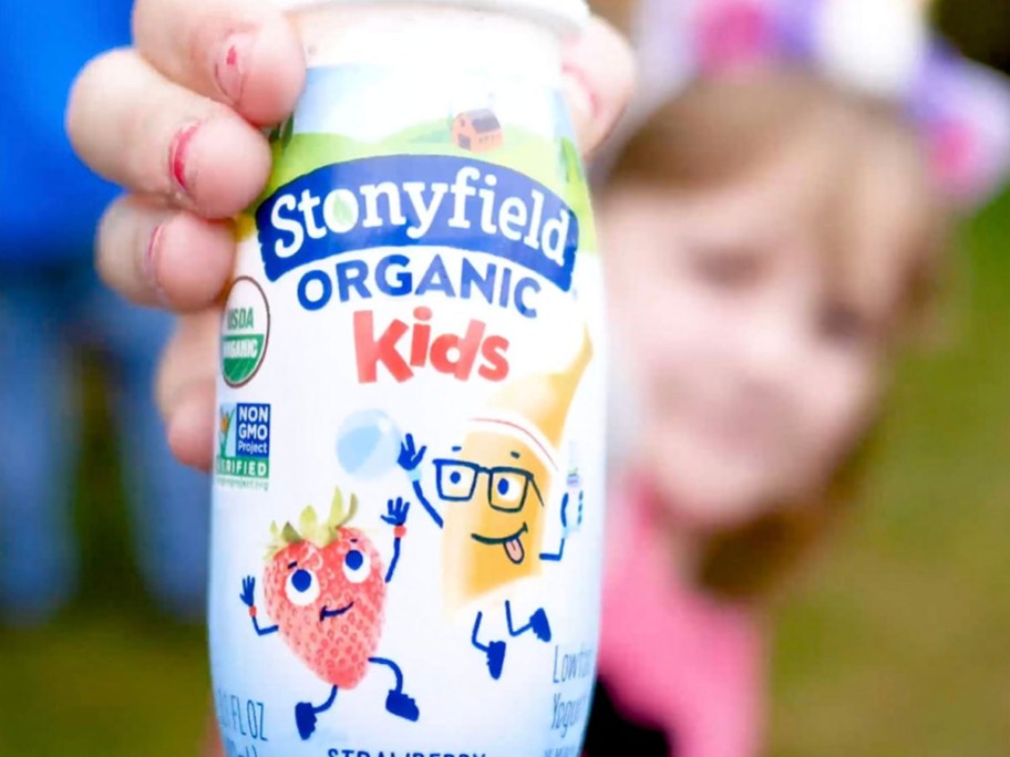 girl holding stonyfield organic smoothie bottle