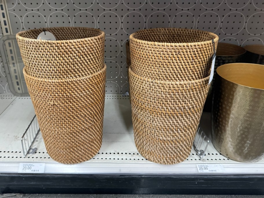 rattan bathroom trash cans stacked on shelf at Target