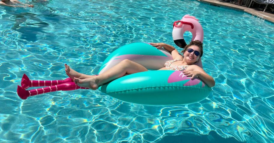 girl on Sun Squad Flamingo Pool Float with Legs in pool