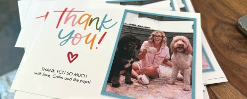 stack of thank you cards on a wood table
