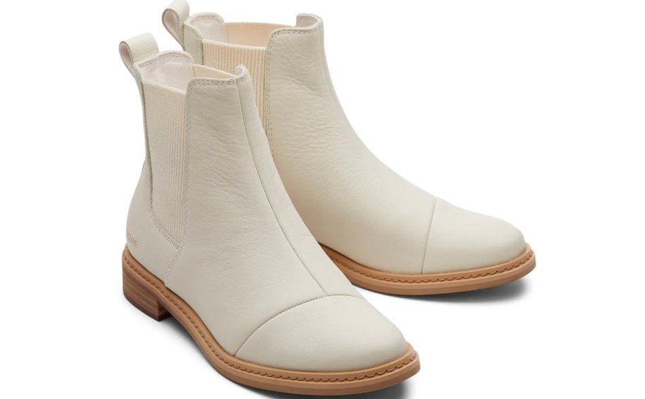 pair of white toms boots