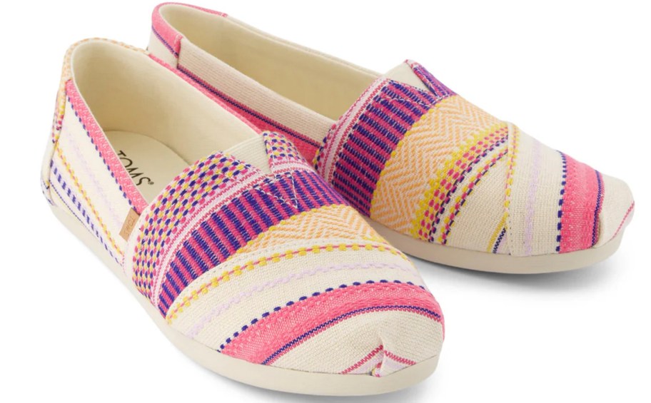 pink, purple and white toms canvas shoes 