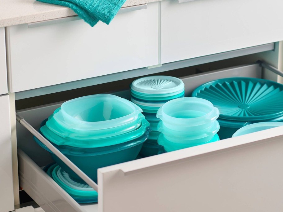 blue tupperware in kitchen drawer