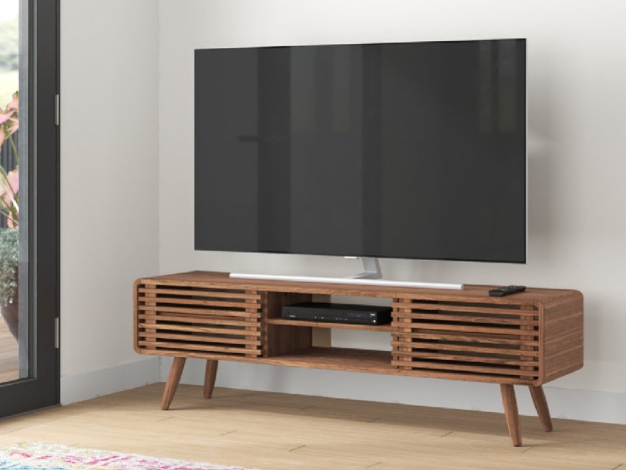 tv stand displayed with tv