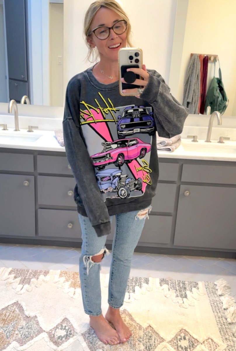 woman taking bathroom selfie wearing hot rod sweatshirt