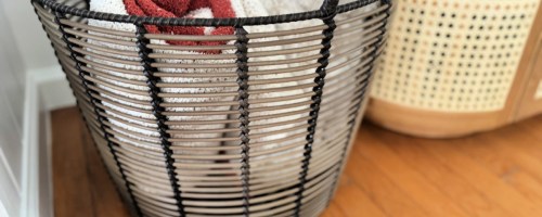 walmart basket with rolled blankets inside