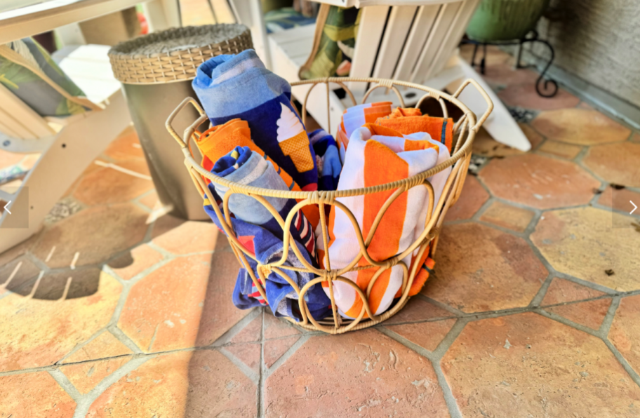 walmart basket with rolled pool towels