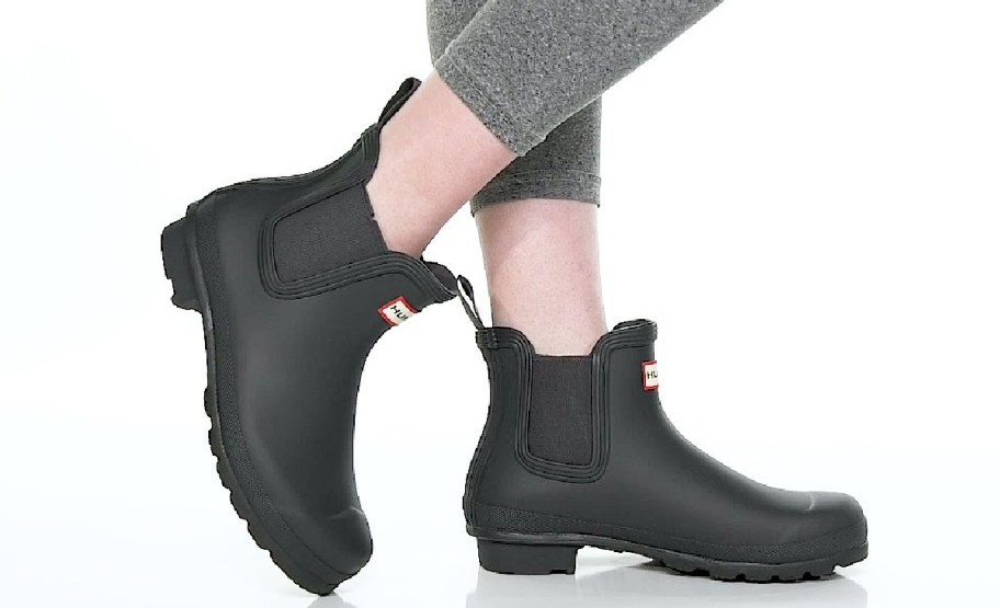 woman wearing Hunts boots in black