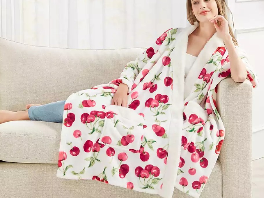 woman wearing cherry thorw on the couch