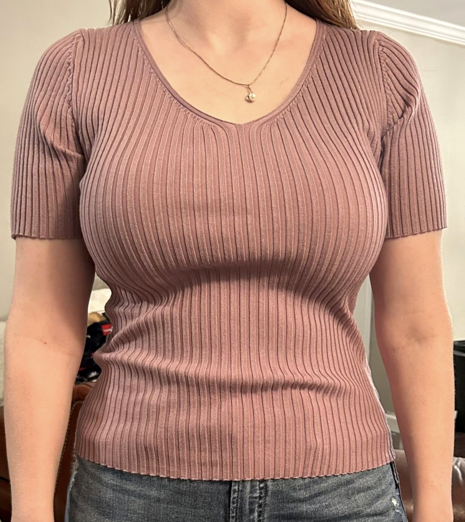 woman wearing v neck ribbed top 