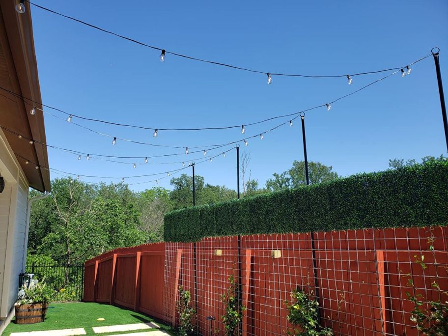 Outdoor string lights, strung over a patio 