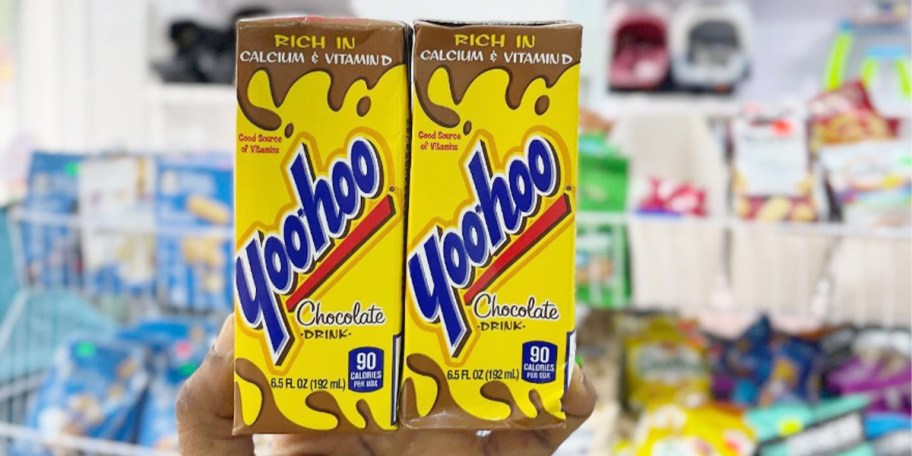 hand holding two boxes of yoo hoo