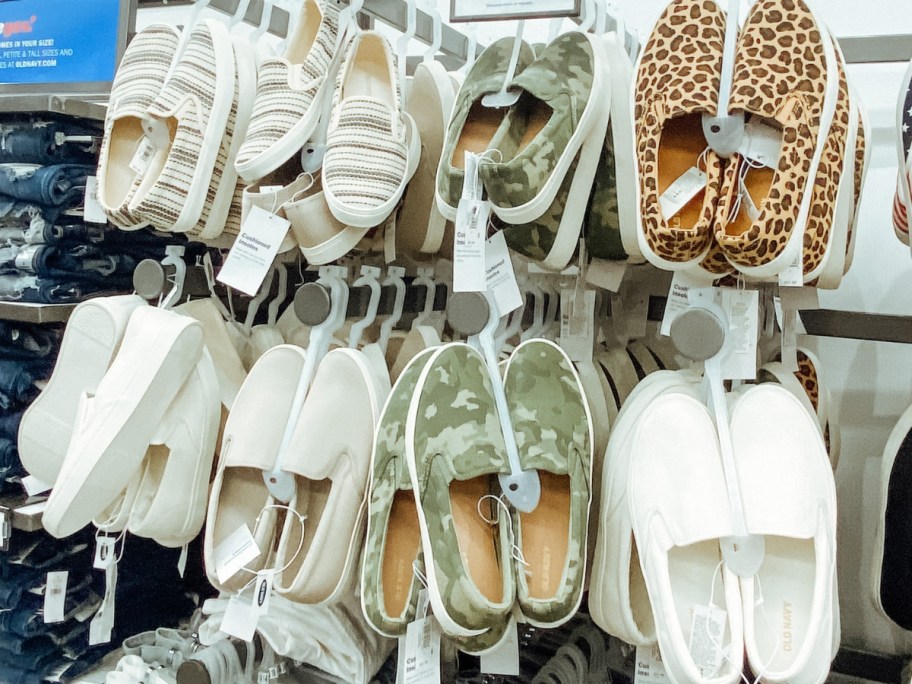 women's and men's slip on sneakers on a wall display