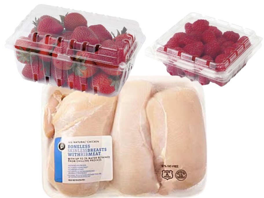 Strawberries and raspberries in plastic containers and pack of boneless chicken breasts