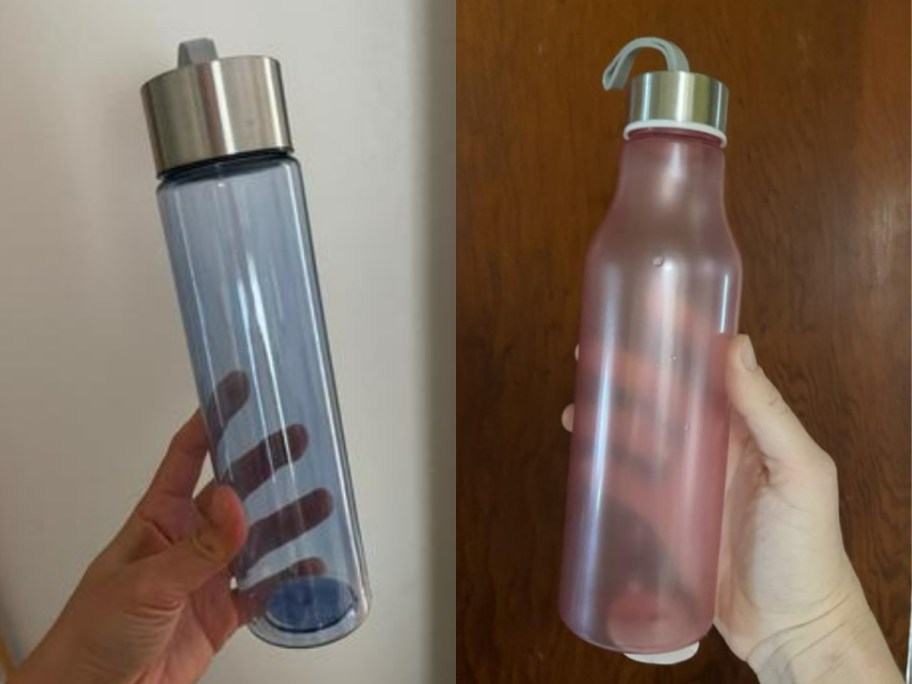hands holding different color water bottles with carry straps