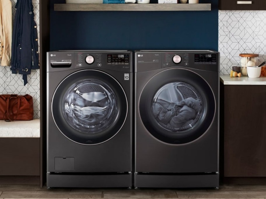 black LG front load washer and dryer in a laundry room