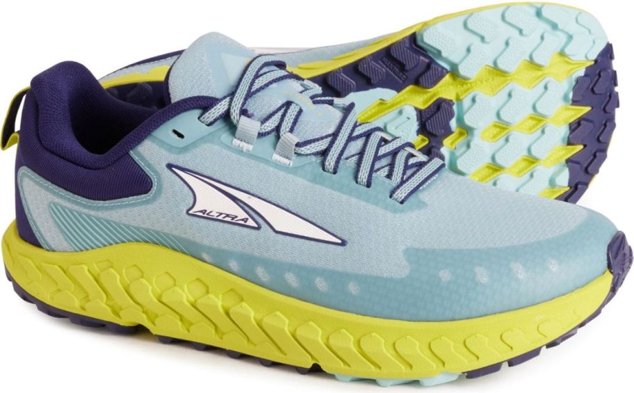 a pair of light blue womens running shoes
