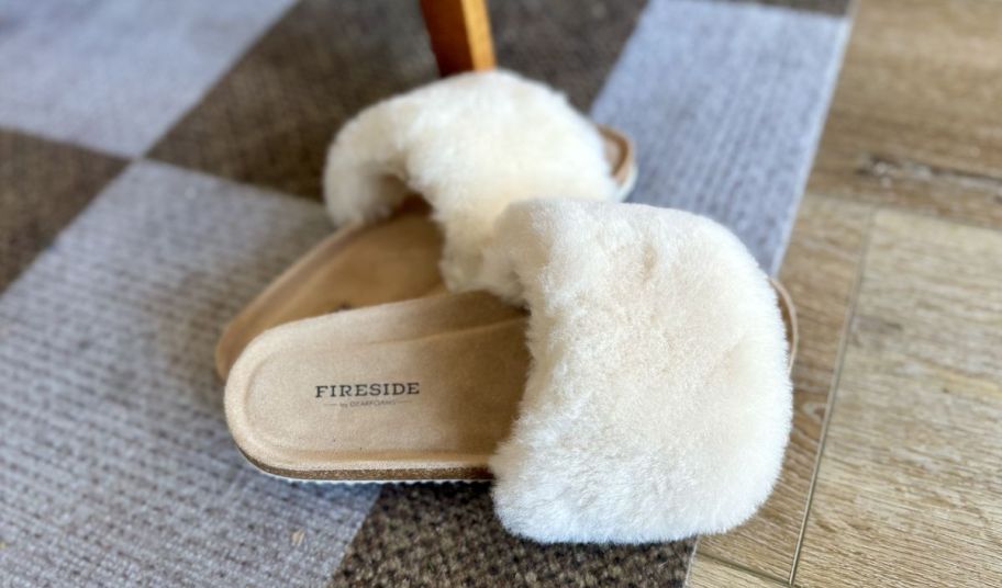 dearfoams fireside slippers sitting on a rug