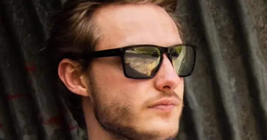man wearing black and silver Oakley's sunglasses