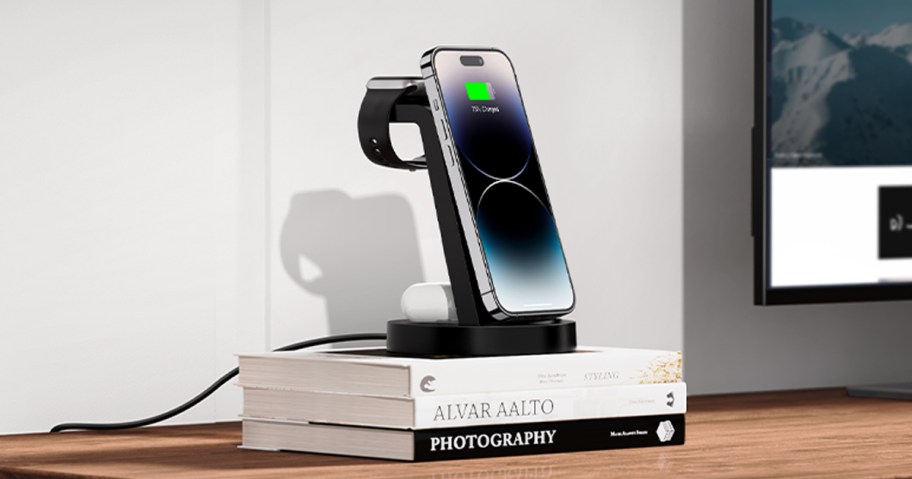 phone charger sitting on a stack of books