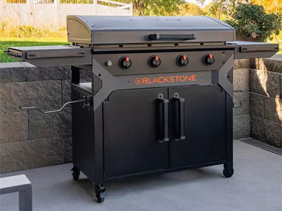 large Blackstone griddle with cabinet on back patio
