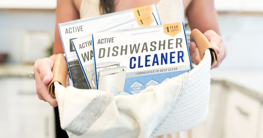 woman holding up basket with Active Appliance Cleaners inside