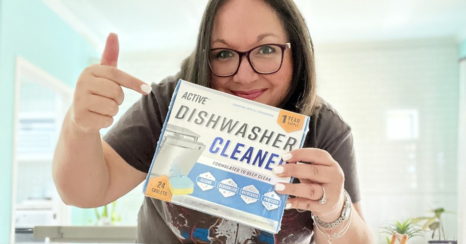 woman holding up and pointing to a box of Active Dishwasher Cleaner Tablets