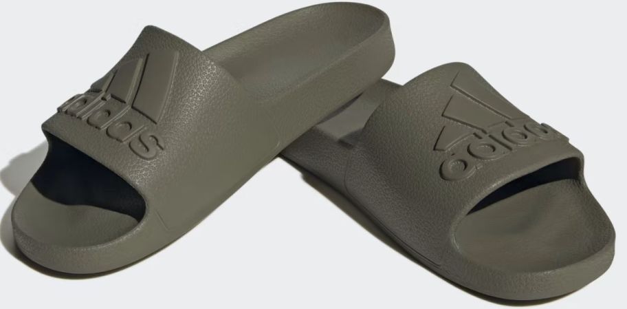 a pair of army green slides