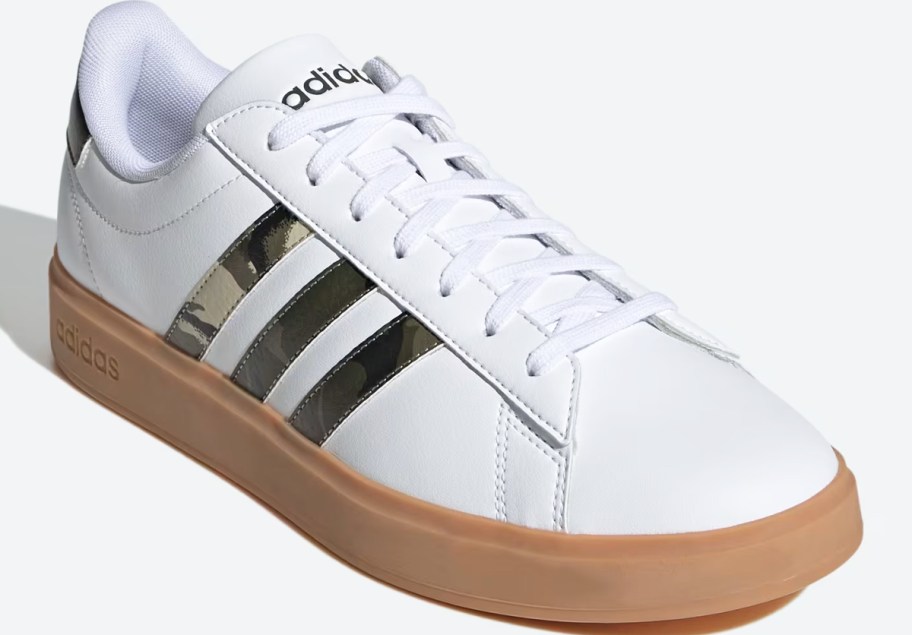 white sneaker with 3 camo print stripes