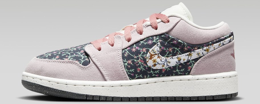 pink, white and black floral Nike Jordan shoe