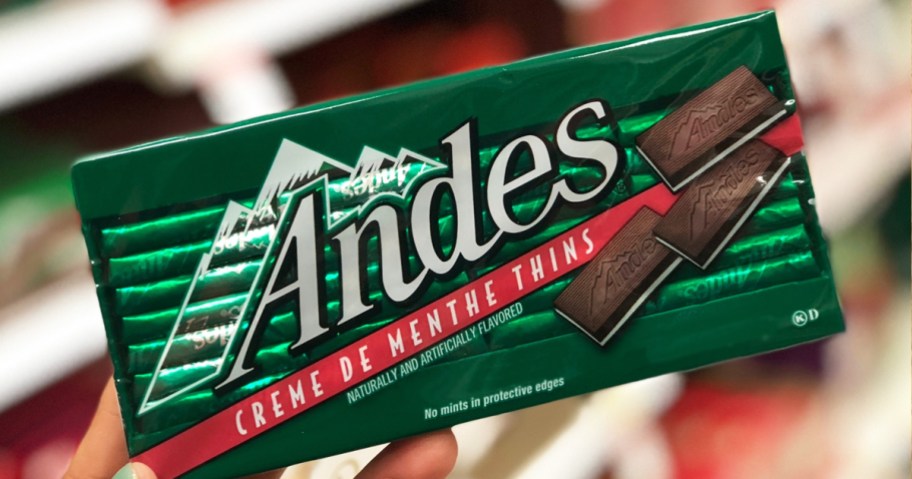 hand holding up a green package of Andes Mints