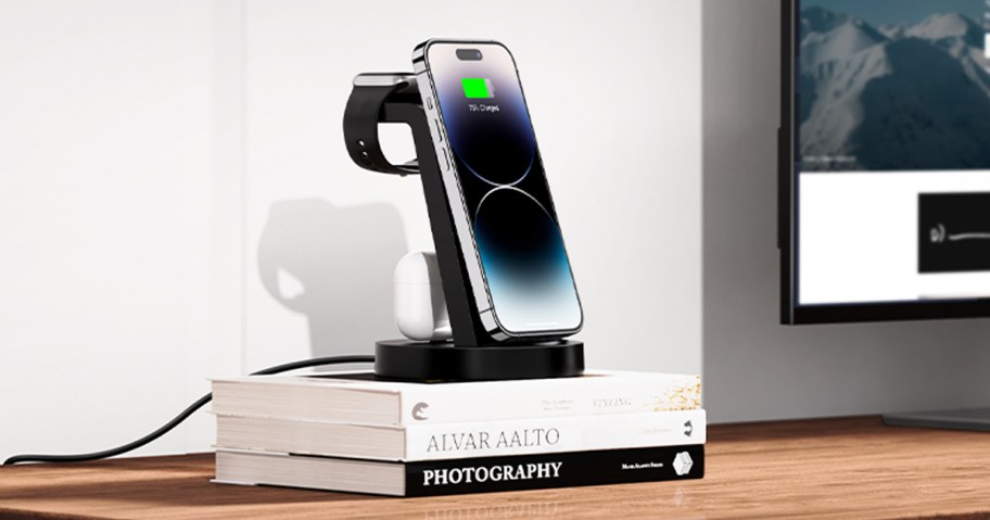 iphone and apple watch on black charging station