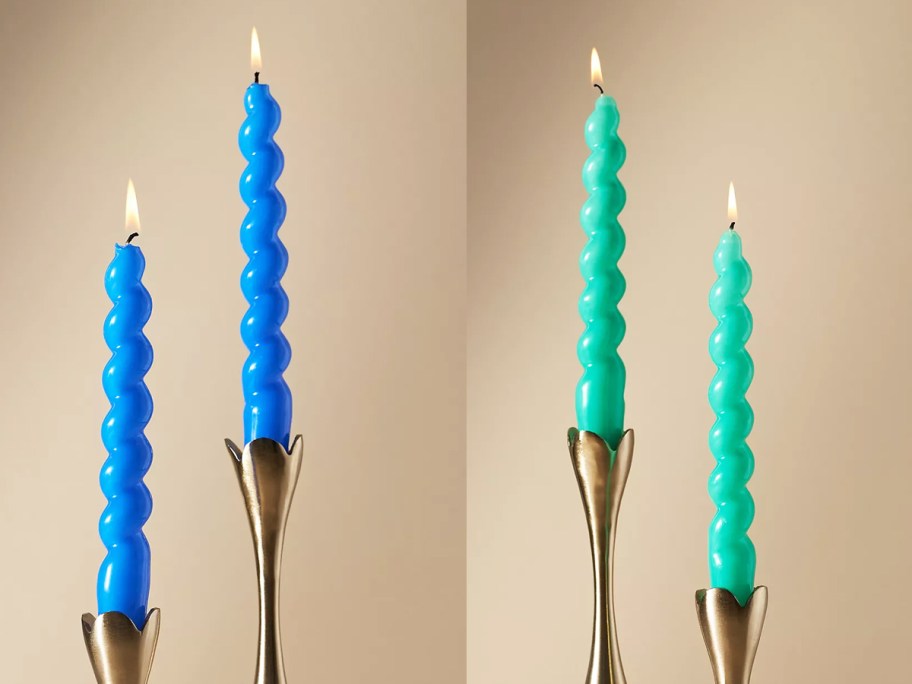 blue and green spiral taper candles in gold candle holders