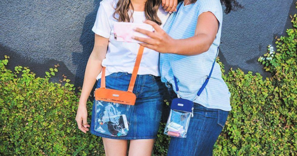 women wearing Baggallini clear bags and taking selfie