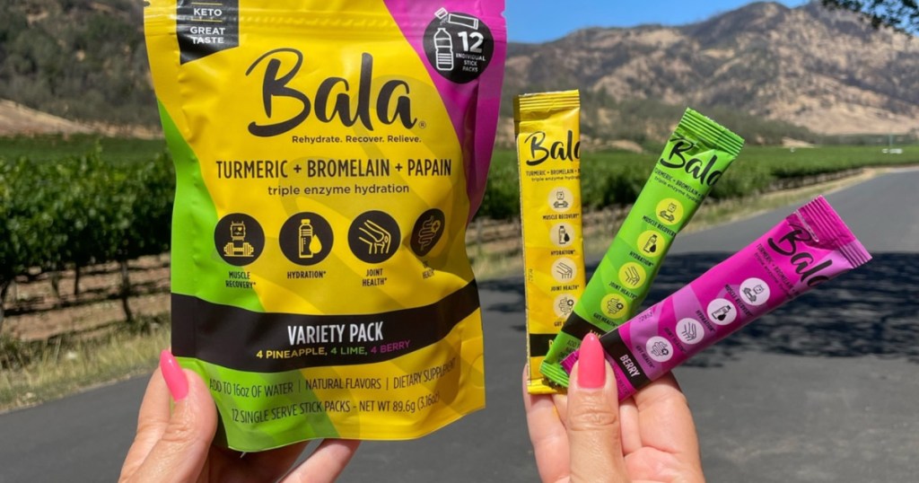 person holding up Bala Drink Mix 12 pack