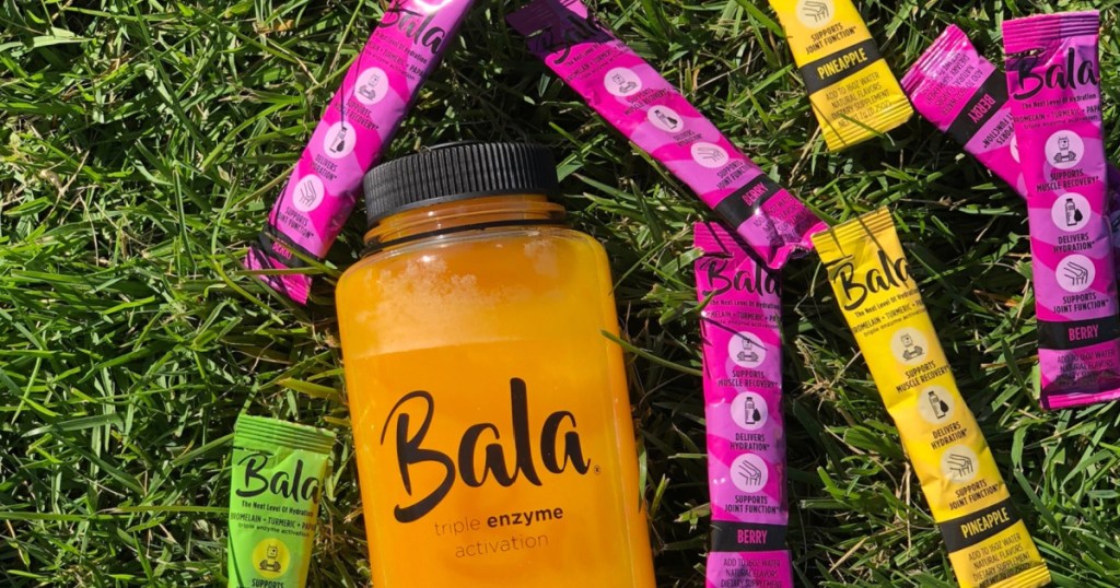 Bala Drink Mix in water bottle on grassy field