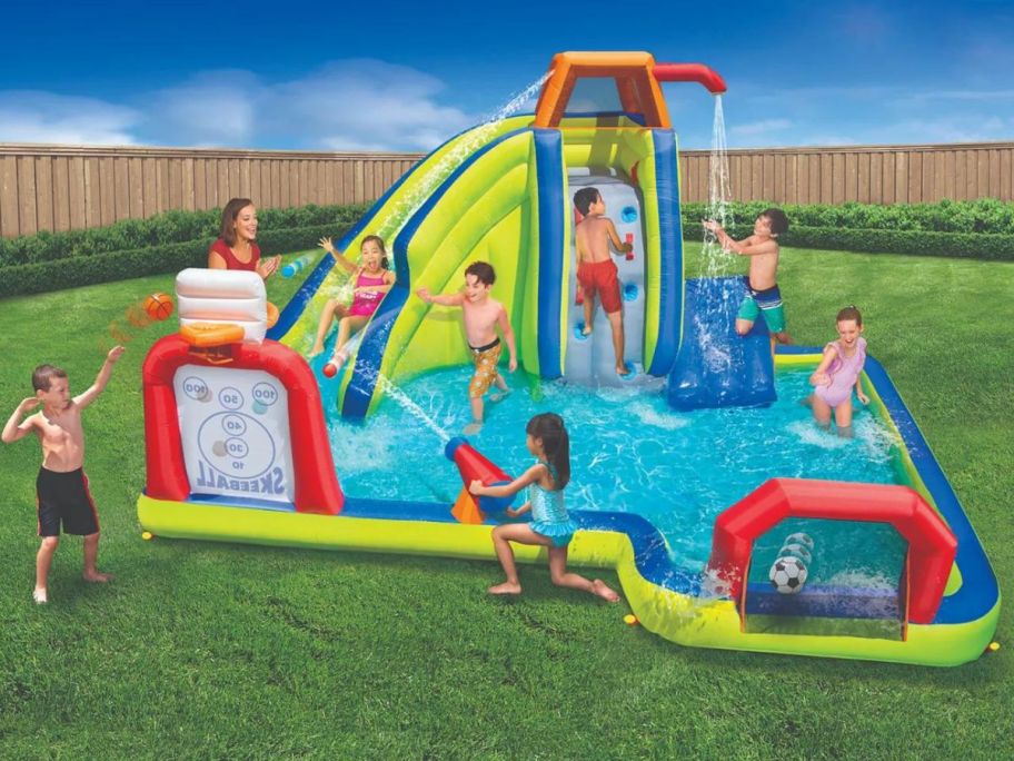 A Banzai Inflatable Water park with kids playing in it