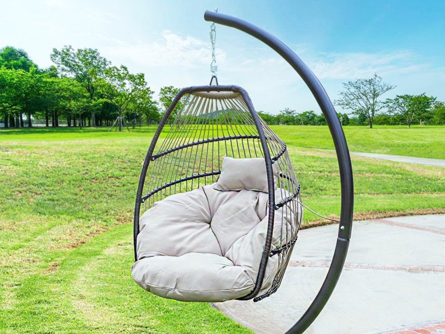 hanging egg chair with white cushion