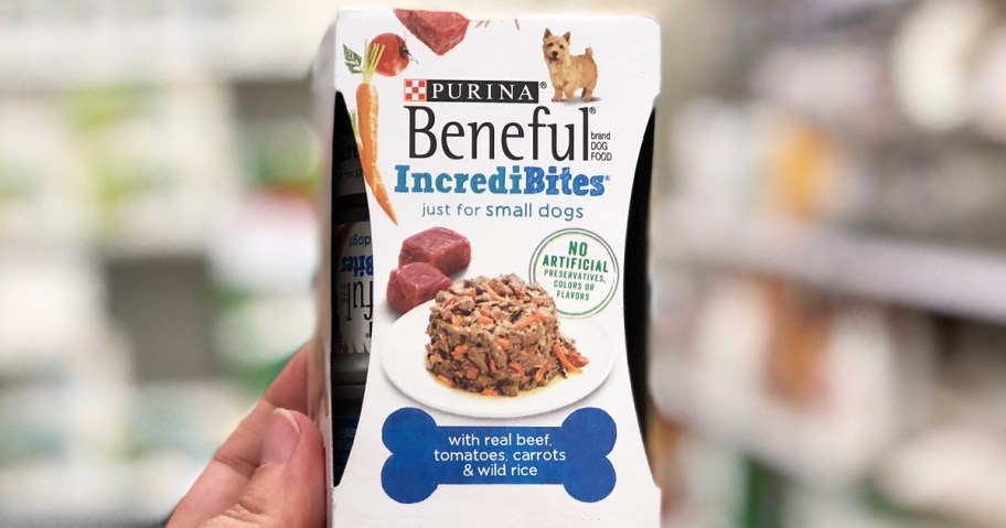hand holding up a pack of Beneful IncrediBites Wet Dog Food