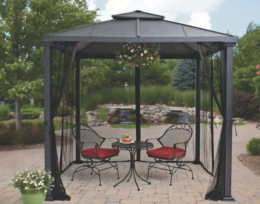 Black metal gazebo with black mosquito net