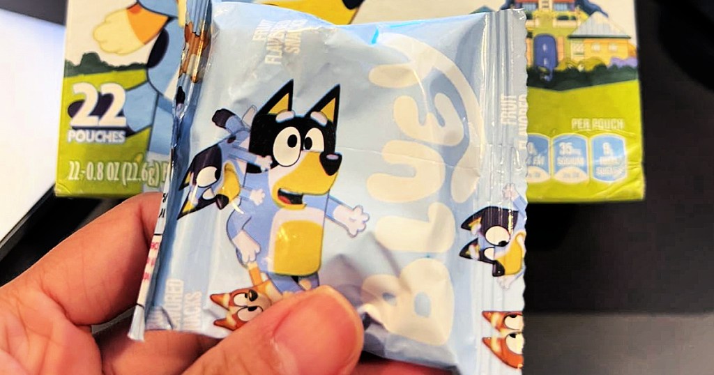 person holding pack of bluey fruit snacks