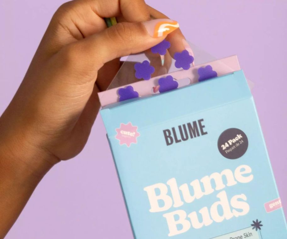 Person holding a Blume Buds Power Patches for Acne Prone Skin 24-Pack