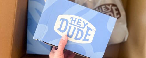 Box with Hey dude shoes inside