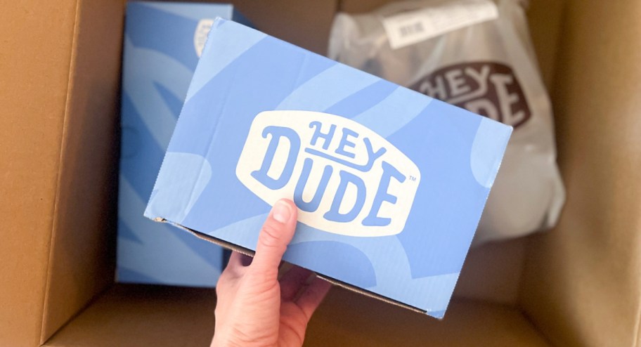 Box with Hey dude shoes inside