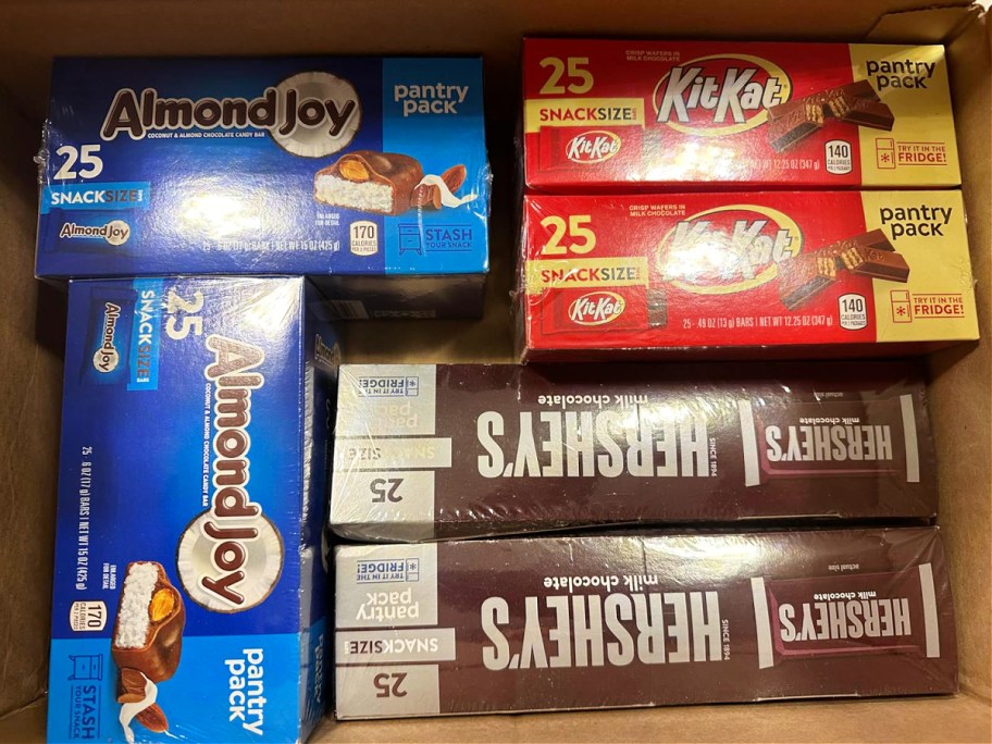 Almond Joy, Kit, Kat, and Hershey's pantry packs inside cardboard b