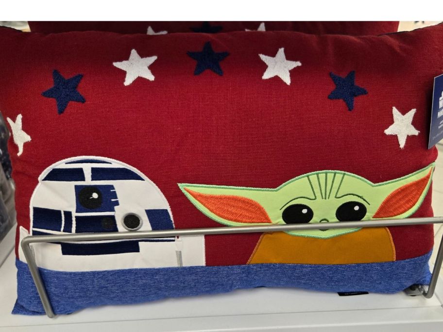 A Star Wars Throw pillow with R2D2 and Grogu