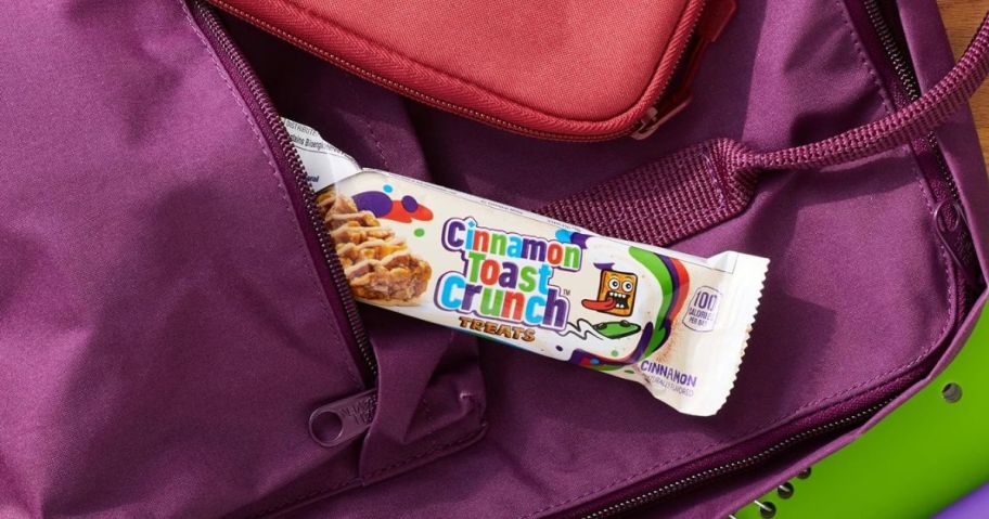 Cinnamon Toast Crunch Breakfast Bar hanging out of purple backpack