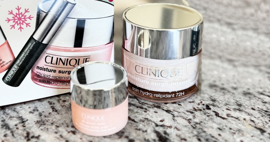 two pink jars of clinique moisturizer on counter