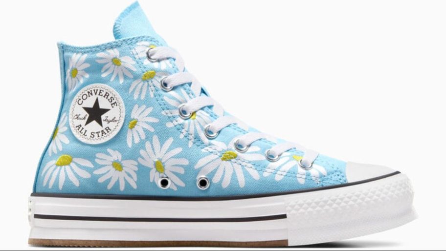 blue high top sneaker with daisies on it