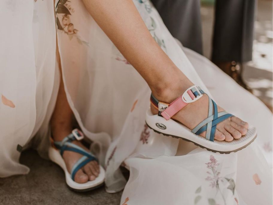 Woman wearing cutom chacos with her wedding dress